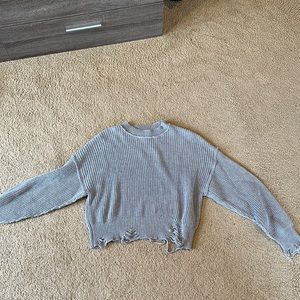 Grey distressed knit sweater